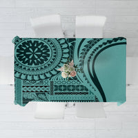 Turquoise patterned tablecloth with geometric and botanical motifs, rectangular coverage