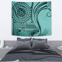 Turquoise siapo tapestry wall hanging with large circular designs and dense geometric borders.
