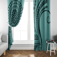 Turquoise window curtain with mandala print panel and matching solid turquoise side section