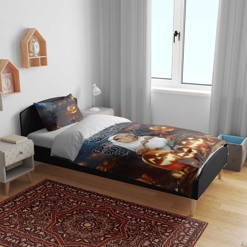 Halloween bedding set on bed: capybara ghost duvet with matching pillows and jack-o-lanterns