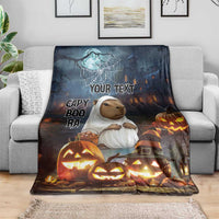 Halloween throw blanket with capybara ghost design, glowing jack-o-lantern pumpkins and “Your Text”
