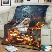 Halloween blanket showing capybara in ghost costume, glowing pumpkins, and customizable “Your Text”