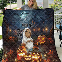 Halloween quilt blanket in dark blue with capybara, ghost web, “YOUR TEXT” and glowing jack-o’-lanterns