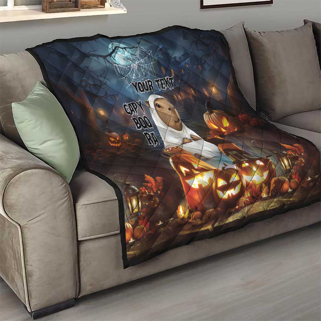 Halloween quilt throw in dark blue with capybara, “YOUR TEXT,” ghost web and lit pumpkins