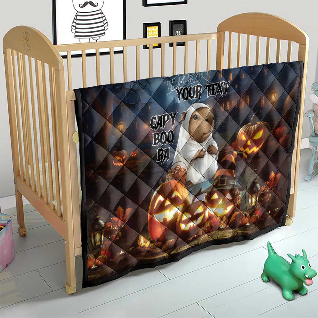 Halloween quilt for crib in dark blue with capybara, “YOUR TEXT,” ghost web and glowing jack-o’-lanterns