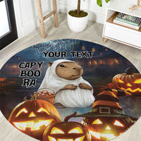 Round Halloween carpet with capybara in ghost costume, pumpkins, and 'YOUR TEXT'.