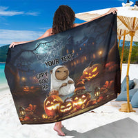 Black Halloween sarong with capybara, ghost, pumpkins, and jack-o-lanterns graphic