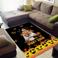 Black Halloween area rug with Spooky Season text, pumpkins, bats, skulls, and bear graphic center.
