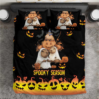 Black bedding set with capybara Halloween characters, pumpkins, and 'Spooky Season' on duvet and pillows