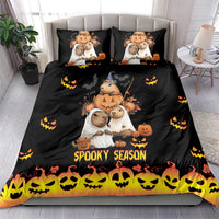 Black bedding set with capybara Halloween characters, pumpkins, and 'Spooky Season' on duvet and pillows