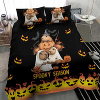 Black bedding set with capybara Halloween characters, pumpkins, and 'Spooky Season' on duvet and pillows