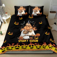Black bedding set with capybara Halloween characters, pumpkins, and 'Spooky Season' on duvet and pillows