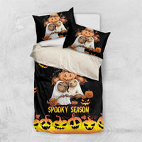 Black duvet set with capybara Halloween characters, pumpkins, and 'Spooky Season' on duvet and pillows