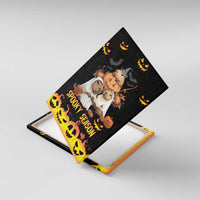 Black canvas wall art shown at an angle, with pumpkins, animals, and “Spooky Season”