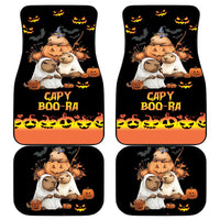 Set of four black car mats with orange edging and Capy Boo-Ra pumpkin-bat graphics.