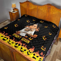 Black quilt on bed with quilted diamonds, Halloween bear print, and 'Spooky Season' bottom