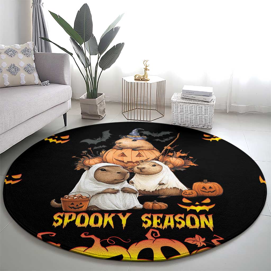Black round Halloween carpet with bear and rabbit characters holding pumpkins and 'Spooky Season'