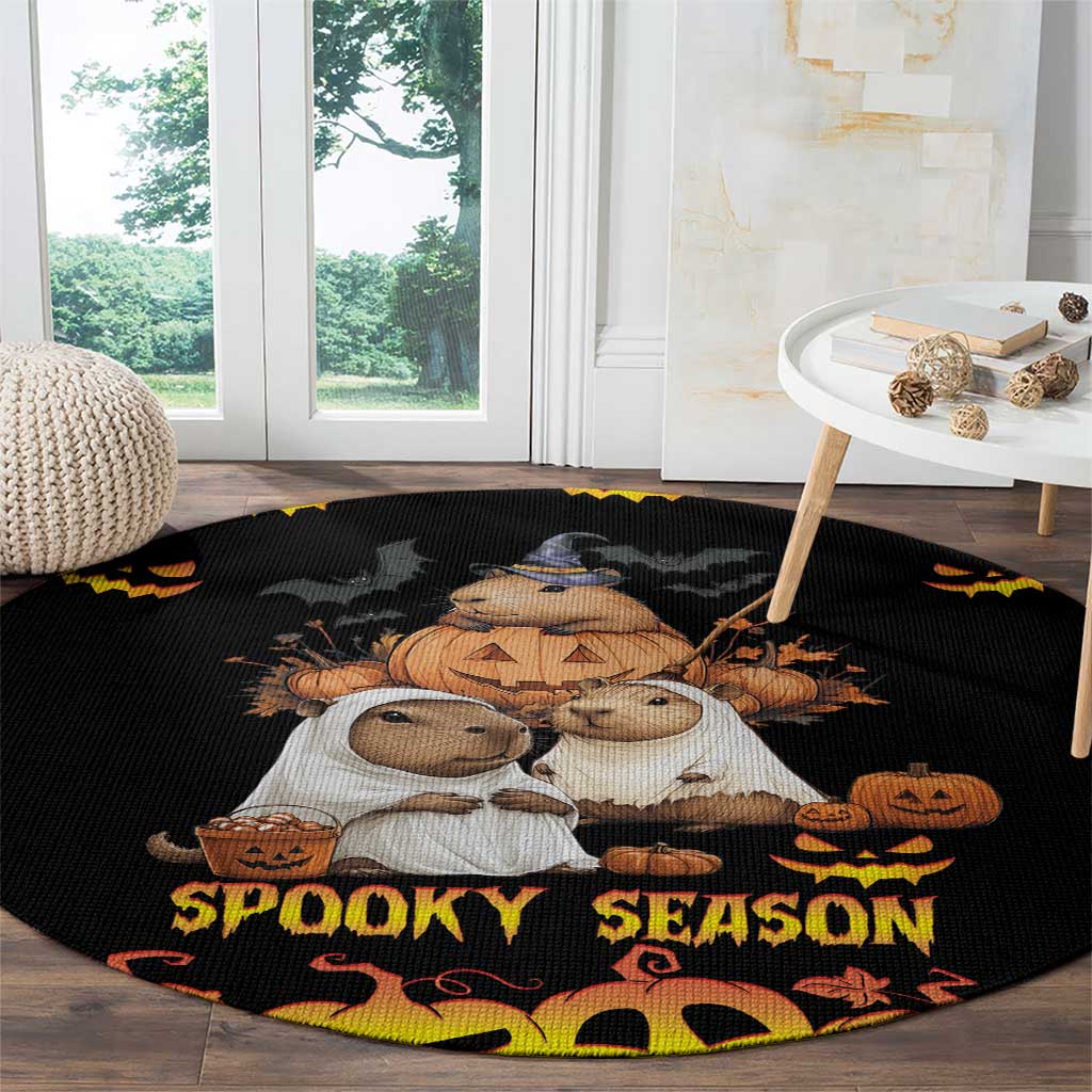 Black round Halloween carpet featuring animal characters with pumpkins and 'Spooky Season' border