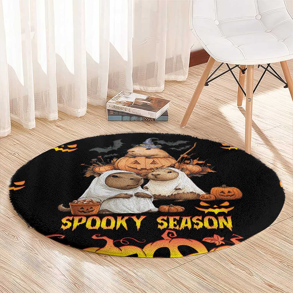 Black round Halloween carpet with cuddly animal trio and 'Spooky Season' lettering in center