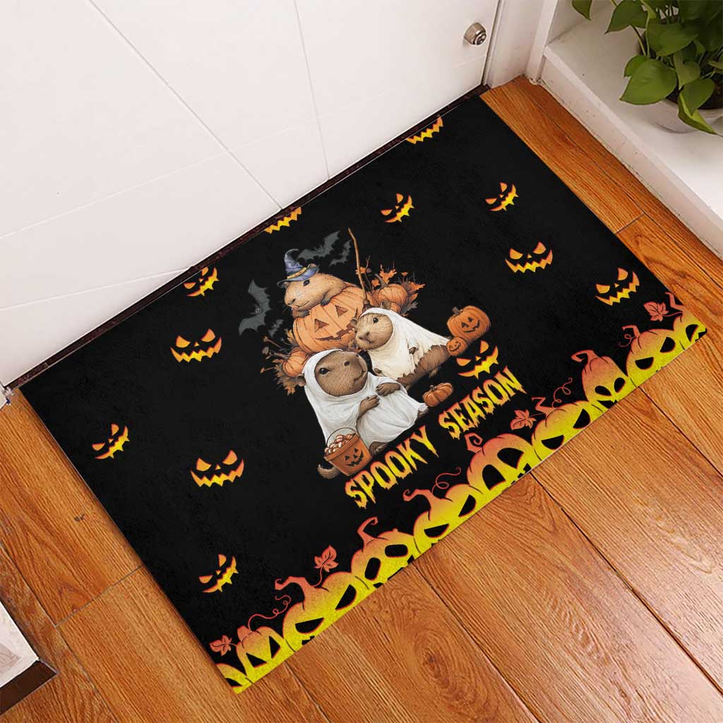 Black Halloween rubber doormat with spooky animal trio, jack-o'-lanterns, 'Spooky Season'