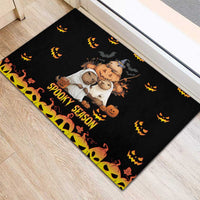 Black Halloween rubber doormat with cartoon animals, pumpkins, and yellow 'Spooky Season' lettering