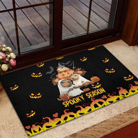 Black rubber Halloween doormat with bear-and-rat characters, jack-o'-lanterns, and 'Spooky Season'