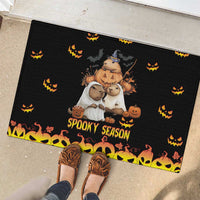 Black rubber doormat with three cartoon animals, jack-o'-lanterns, and 'Spooky Season' text edge