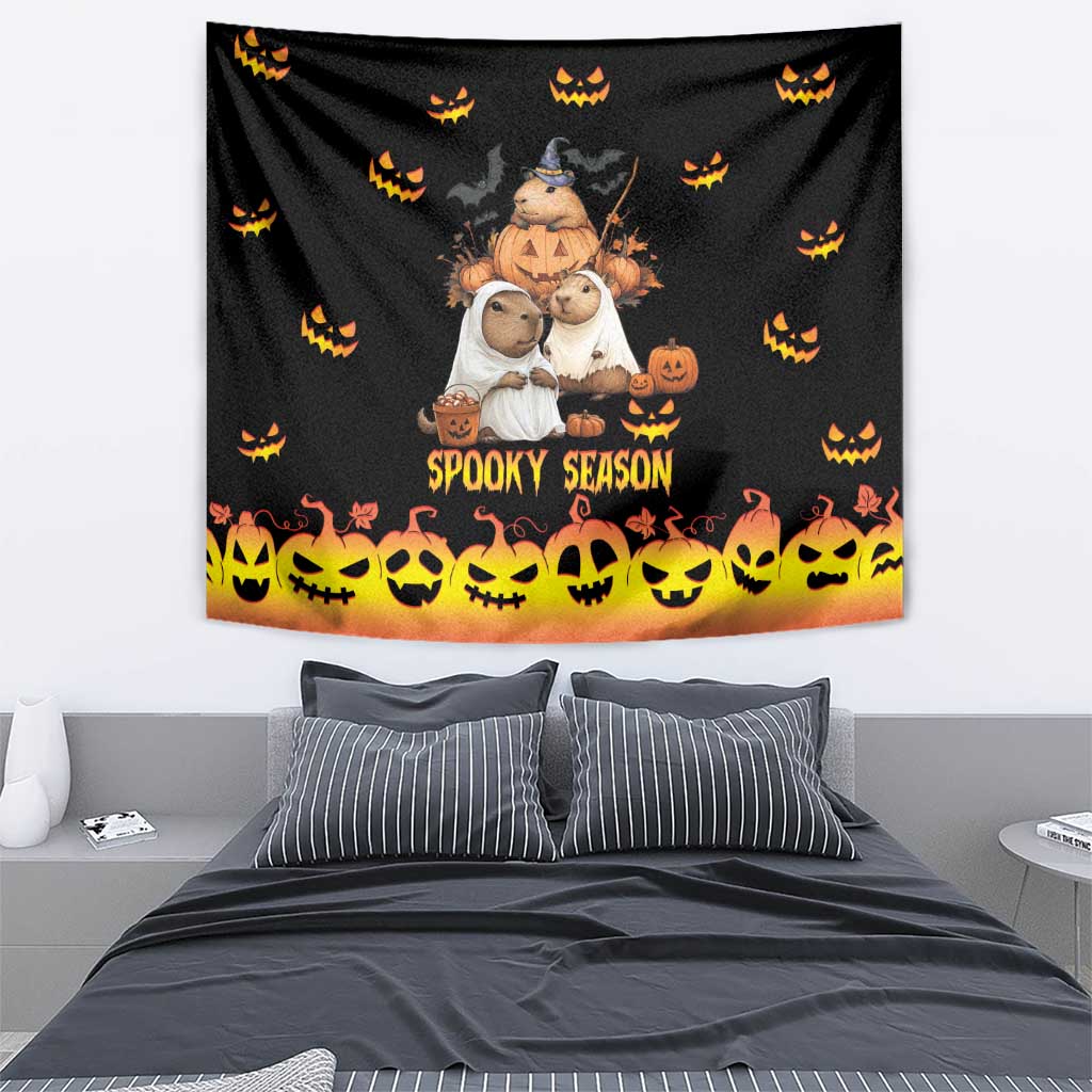 Black Halloween tapestry featuring 'Spooky Season' lettering and a row of yellow jack-o-lantern faces