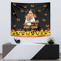 Black Halloween tapestry with central character trio, 'Spooky Season' text, and orange skull-and-pumpkin strip