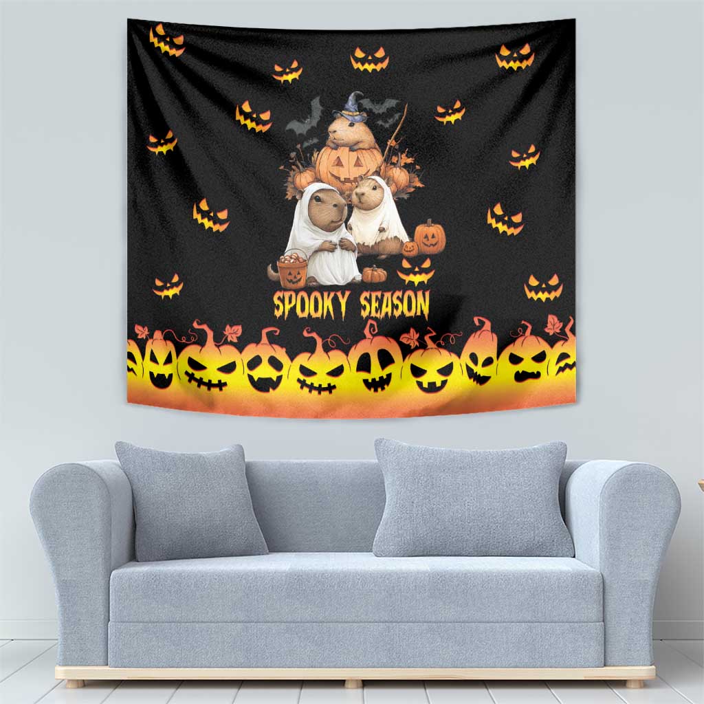 Black wall tapestry with 'Spooky Season' lettering, orange gradient bottom, and jack-o-lantern pattern