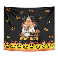 Black Halloween tapestry showing 'Spooky Season' text with jack-o-lantern icons and orange bottom glow