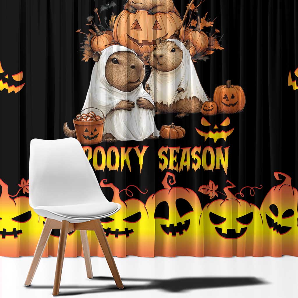 Close-up Halloween window curtain: black fabric with spooky cartoon animals and jack-o'-lanterns