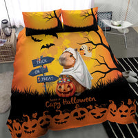 Orange Halloween bedding set close view: capybara ghost with white sheet, bats, pumpkins, text