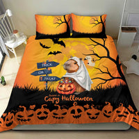 Orange Halloween bedding set with two pillows; capybara ghost, “Trick or Treat” sign and pumpkins