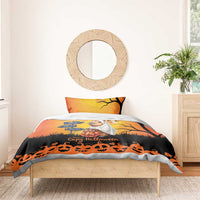 Orange Halloween bedding set on wooden bed: capybara ghost center, black bats and jack-o-lanterns