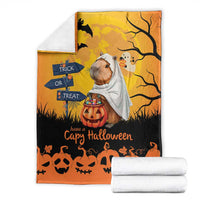 Orange Halloween capybara ghost blanket folded, with pumpkins, bats, and a trick-or-treat sign