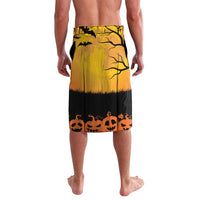 Orange-to-black Halloween shorts with haunted tree silhouette and pumpkin border