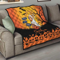 Orange and black Halloween capybara ghost quilt on a living room sofa