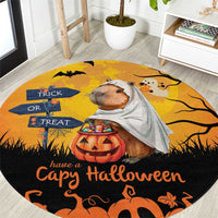 Round orange Halloween rug with capybara ghost, jack-o’-lantern, and Trick or Treat text