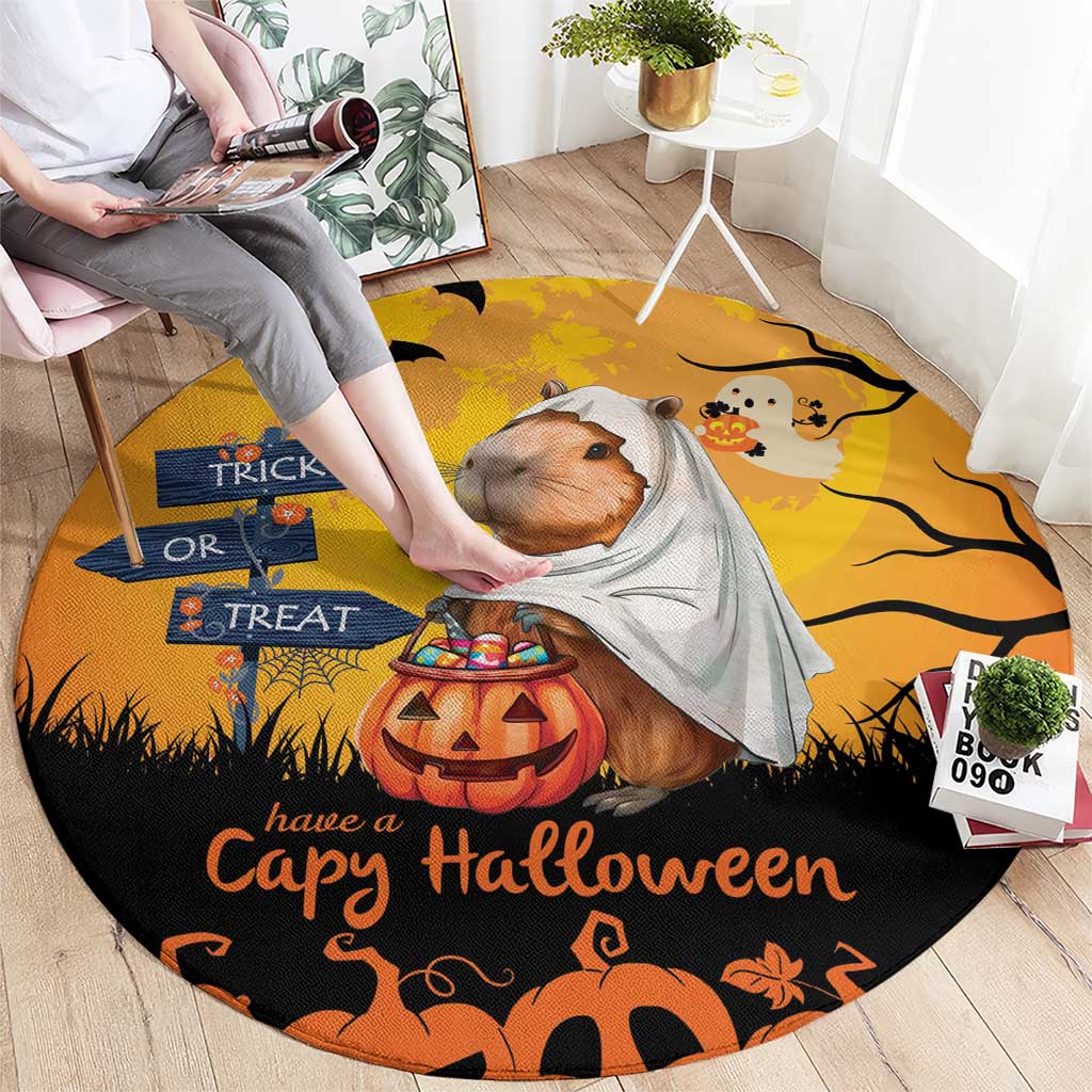 Round orange Halloween rug with capybara ghost in a gray cloak and pumpkin Trick or Treat art