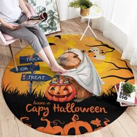 Round orange Halloween rug with capybara ghost in a gray cloak and pumpkin Trick or Treat art