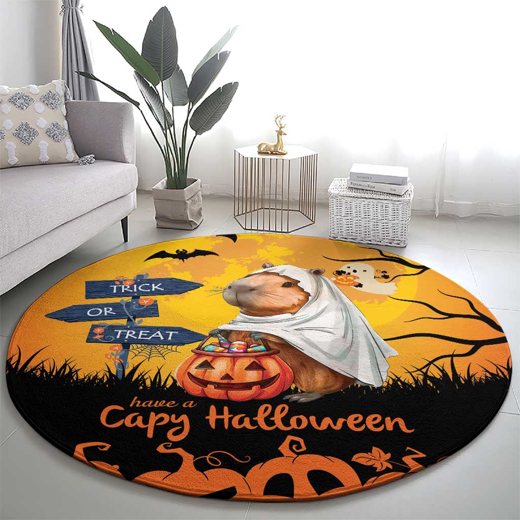 Round orange Halloween rug with capybara ghost, pumpkins, and 'Have a Capy Halloween' text