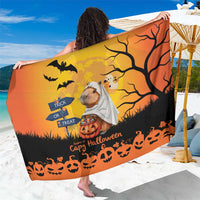 Orange Halloween sarong with black tree, bats, and a capybara ghost graphic