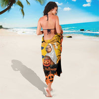Orange Halloween sarong with capybara-ghost print and black bat-and-pumpkin border