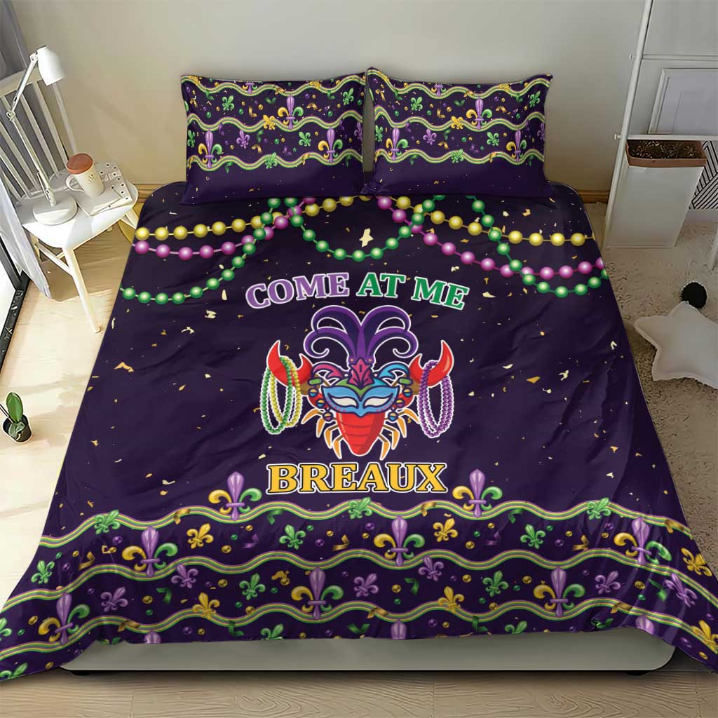 Purple bedding set with two pillows featuring carnival mask center and green-gold fleur-de-lis trim