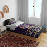 Purple duvet cover with matching pillowcases, carnival mask artwork and green-gold decorative trim
