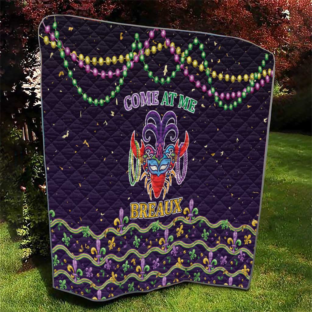 Black quilt with central carnival mask, “Breaux” lettering, and green-purple border