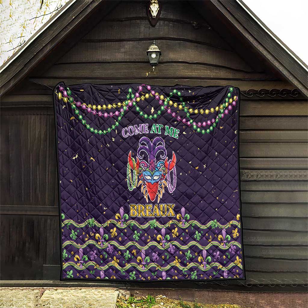 Black quilt hanging in a doorway, with “Come at Me” banner and bead decorations