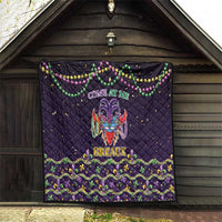 Black quilt hanging in a doorway, with “Come at Me” banner and bead decorations