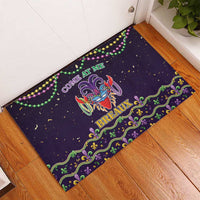 Black rubber Mardi Gras doormat with beads border and “COME AT ME” text